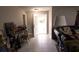 Welcoming entryway with a bright, white front door and decorative floral arrangements at 3661 Se 131St Pl, Belleview, FL 34420