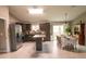 Open kitchen and dining area features modern appliances, dark cabinetry, and ample counter space at 3661 Se 131St Pl, Belleview, FL 34420
