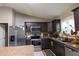 Bright and airy kitchen with granite countertops, stainless steel appliances, and charming rooster accents at 3661 Se 131St Pl, Belleview, FL 34420