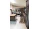 Well-equipped kitchen boasts granite countertops, stainless steel appliances, and dark wood cabinetry at 3661 Se 131St Pl, Belleview, FL 34420