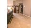 Spacious living area featuring tile floors, neutral paint, and a classic grandfather clock at 3661 Se 131St Pl, Belleview, FL 34420