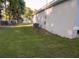 The side yard shows an exterior AC unit and has a chain link fence at 3661 Se 131St Pl, Belleview, FL 34420