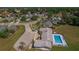 Aerial view of community pool, clubhouse, parking, and surrounding neighborhood at 3738 Crossing Creek Blvd, St Cloud, FL 34772