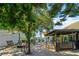 Inviting backyard patio with a stone fire pit, comfortable seating, and a pergola covered outdoor kitchen, perfect for entertaining at 3738 Crossing Creek Blvd, St Cloud, FL 34772