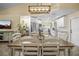 Open dining area flowing into a kitchen, with modern decor and hardwood floors at 3738 Crossing Creek Blvd, St Cloud, FL 34772