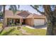 Single Gathering home featuring a two-car garage and front yard with decorative rock landscaping at 3738 Crossing Creek Blvd, St Cloud, FL 34772