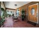 Welcoming front porch featuring ample seating and a well-maintained tile floor at 3738 Crossing Creek Blvd, St Cloud, FL 34772