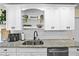Contemporary kitchen featuring granite countertops, white cabinets, and stainless steel appliances at 3738 Crossing Creek Blvd, St Cloud, FL 34772