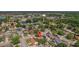 Aerial view showcasing the home's location within a peaceful neighborhood, surrounded by mature trees and local amenities at 3738 Crossing Creek Blvd, St Cloud, FL 34772
