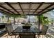 Outdoor patio with comfortable seating around a brick fire pit, perfect for entertaining at 3738 Crossing Creek Blvd, St Cloud, FL 34772