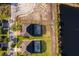 Aerial view of backyard pools and backyard with proximity to pond and lush landscaping at 389 Yellow Snapdragon Dr, Davenport, FL 33837