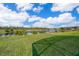 Lush backyard with scenic water views, offering a peaceful and private outdoor retreat at 389 Yellow Snapdragon Dr, Davenport, FL 33837
