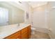Bright bathroom featuring a shower and bathtub combination with a marble vanity at 389 Yellow Snapdragon Dr, Davenport, FL 33837