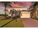 Charming two-story home with a manicured lawn and inviting front entrance at 389 Yellow Snapdragon Dr, Davenport, FL 33837