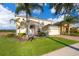 Beautiful two-story home featuring a well-maintained lawn and a spacious two-car garage at 389 Yellow Snapdragon Dr, Davenport, FL 33837