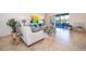Living room featuring tile flooring, neutral furniture, and sliding glass doors to lanai at 389 Yellow Snapdragon Dr, Davenport, FL 33837