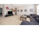 Spacious carpeted living room with a sectional sofa, a large TV, and a decorative coffee table at 389 Yellow Snapdragon Dr, Davenport, FL 33837