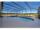 Private screened-in pool surrounded by serene landscaping and comfortable lounge seating at 389 Yellow Snapdragon Dr, Davenport, FL 33837