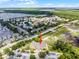 Beautiful aerial view of the multi-Gathering home surrounded by lush green trees and large parking lot at 4551 Jonafree Ln # 103, Kissimmee, FL 34746