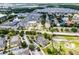 Beautiful aerial view of the multi-Gathering home surrounded by lush green trees and large parking lot at 4551 Jonafree Ln # 103, Kissimmee, FL 34746