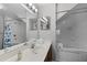 Clean bathroom with a tub, shower, and mirrored vanity area at 4551 Jonafree Ln # 103, Kissimmee, FL 34746