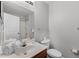 Bright bathroom featuring a wood vanity, large mirror, and shower at 4551 Jonafree Ln # 103, Kissimmee, FL 34746