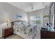 Charming bedroom with coastal-themed decor and a bright window view at 4551 Jonafree Ln # 103, Kissimmee, FL 34746