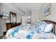 Comfortable bedroom with a large bed, coastal theme, and dresser with a TV at 4551 Jonafree Ln # 103, Kissimmee, FL 34746