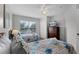 Bright guest bedroom with twin beds, a TV, and a spacious closet at 4551 Jonafree Ln # 103, Kissimmee, FL 34746