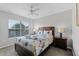 Bright bedroom featuring a turtle-themed bedspread, ceiling fan, and window with natural light at 4551 Jonafree Ln # 103, Kissimmee, FL 34746