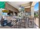 Outdoor tiki bar area with seating, TVs and bar area at 4551 Jonafree Ln # 103, Kissimmee, FL 34746