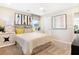 Bedroom featuring a ceiling fan, carpeted floor, and a comfortable bed with colorful decorative artwork at 5228 Bee Balm St, Lake Hamilton, FL 33851