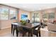 Inviting living space seamlessly blending dining, living, and outdoor areas, perfect for modern living and entertaining at 5228 Bee Balm St, Lake Hamilton, FL 33851