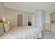 Comfortable bedroom featuring a queen-sized bed, dresser, closet, and soft, neutral tones at 553 Bailey Cir, Davenport, FL 33897
