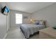 Comfortable bedroom with a queen-size bed, window, closet, and neutral tones for a relaxing atmosphere at 553 Bailey Cir, Davenport, FL 33897