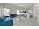 Inviting living room with modern decor, light tile flooring, and an open-concept layout at 553 Bailey Cir, Davenport, FL 33897