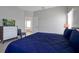 A spacious main bedroom features stylish furniture and decor, including a mounted television at 553 Bailey Cir, Davenport, FL 33897