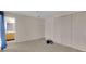 Bedroom with carpet, closet, and a glimpse of the bathroom at 572 Floral Dr, Kissimmee, FL 34743