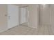 Tiled entryway with mirrored closet doors and a view of the front door at 572 Floral Dr, Kissimmee, FL 34743