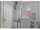 The laundry room has a washing machine, dryer, water heater, and a door to the outside at 572 Floral Dr, Kissimmee, FL 34743
