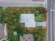 Aerial view of a single-Gathering home on a neatly landscaped lot surrounded by trees at 673 E Church Ave, Longwood, FL 32750