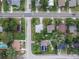 An aerial view showcasing the neighborhood's layout, streetscape, and the surrounding residential properties at 673 E Church Ave, Longwood, FL 32750