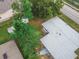 Birds eye view of a single-Gathering home with a large, green backyard and mature trees at 673 E Church Ave, Longwood, FL 32750