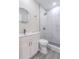 Updated bathroom featuring a tiled shower and white vanity at 673 E Church Ave, Longwood, FL 32750