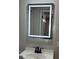 Close up on a modern bathroom sink with LED mirror at 673 E Church Ave, Longwood, FL 32750