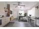 A cozy bedroom featuring a bed and a bar, plus a kitchen for added convenience at 673 E Church Ave, Longwood, FL 32750