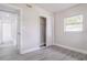 A bedroom features a window and closet with sliding doors at 673 E Church Ave, Longwood, FL 32750