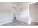 A bedroom features an open closet and gray wood flooring at 673 E Church Ave, Longwood, FL 32750
