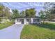 Charming single-story home with fresh gray paint and manicured front lawn at 673 E Church Ave, Longwood, FL 32750