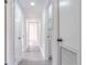 Bright hallway with modern laminate flooring and neutral paint at 673 E Church Ave, Longwood, FL 32750